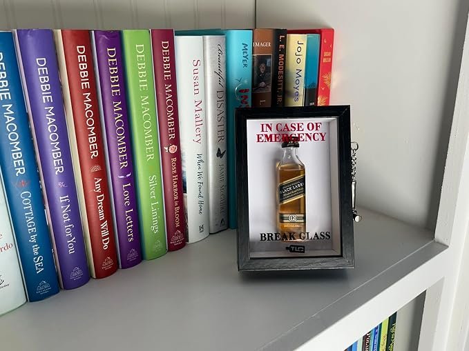 Black Emergency Break Glass Display Box on bookshelf